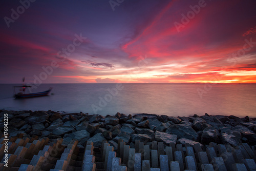 scenery of sunset at Tanjung Piandang,Perak,Malaysia. Soft focus,motion blur due to long exposure. visible noise due to high iso