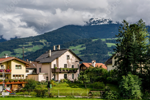 Beautiful Alpine village landscape with mountains at summer	