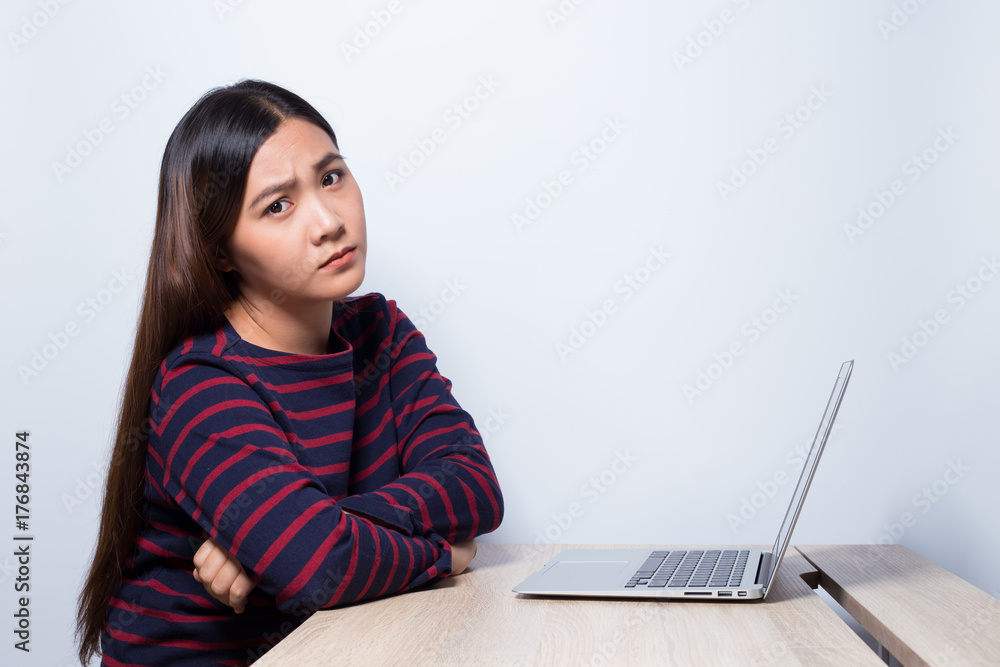 Naklejka premium Sad woman at work