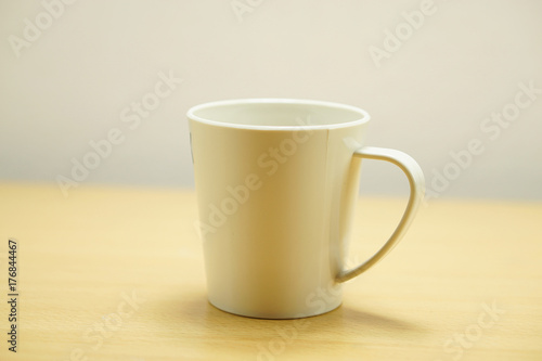 Cup  on wood table background.