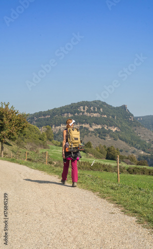 Female athlete to trekking through forests