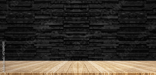 Wood plank table top at black stack layer marble wall background,Mock up for display or montage of product,Banner or header for advertise on social media.