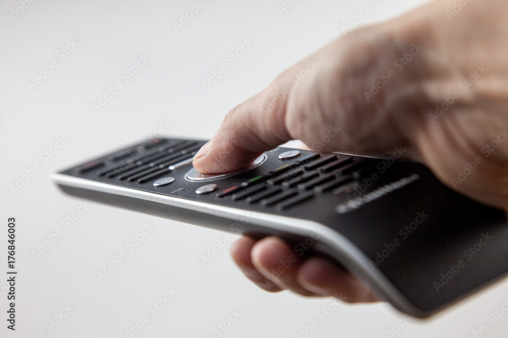 TV remote control in hand on white background TV remote control in hand on white background