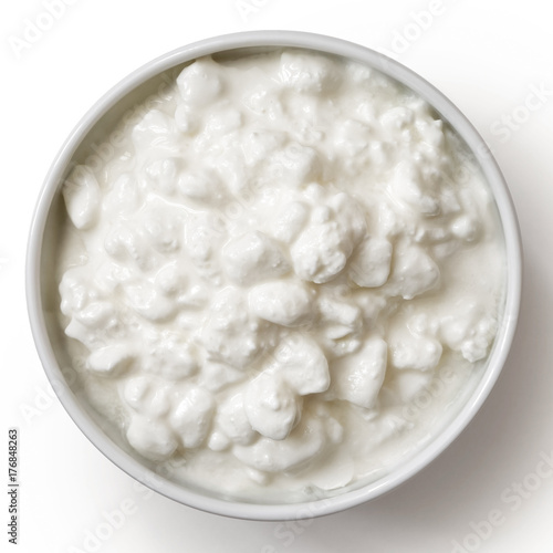 Принти на полотні White ceramic bowl of chunky cottage cheese isolated on white from above
