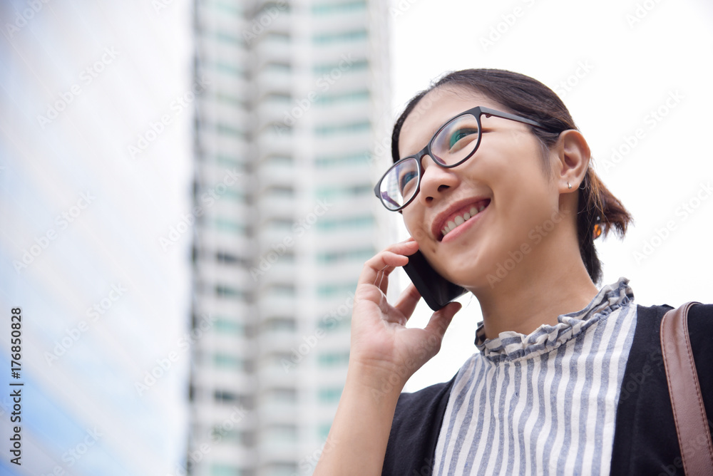 Chinese Business Woman talking business.