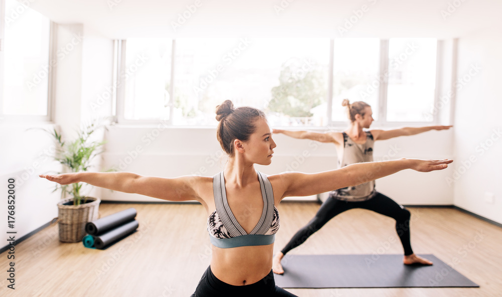 Fototapeta premium Fitness people doing yoga in health center