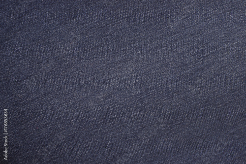 The texture of the jeans is blue. Background of blue jeans material.
