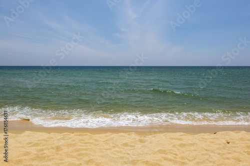 Vacation and peace concept.Beautiful tropical beach, soft wave hitting sandy beach under brighter sunny day