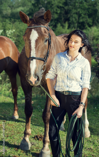 young girl with her horse poseing together
