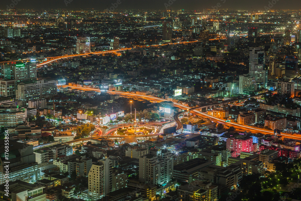 Thailand victory monument and main road traffic at night in Bangkok, Thailand