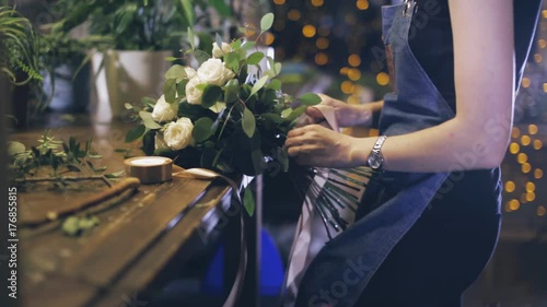 Close-up. florist making bouquet at flower shop