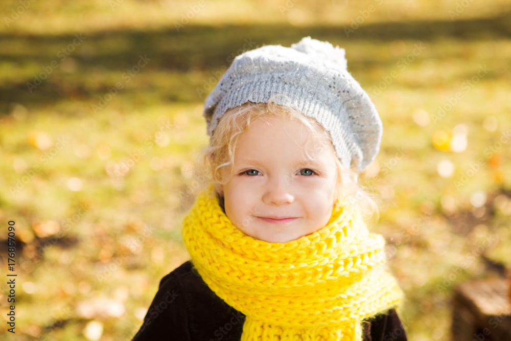 portrait adorable little girl in a scarf in the autumn park portrait adorable little girl in a scarf in the autumn park