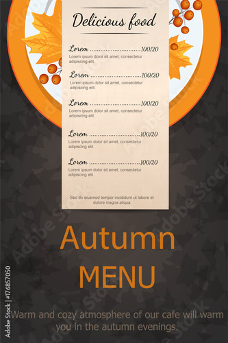 Autumn menu. Plate with yellow leaves Rowan. On a wooden table.