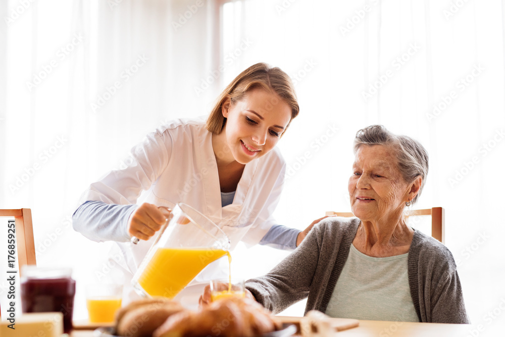 Health visitor and a senior woman during home visit. Health visitor and a senior woman during home visit.