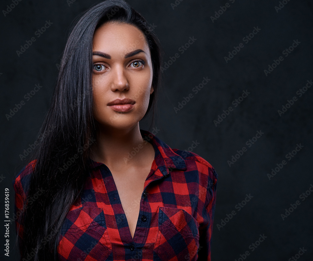 A woman dressed in a red fleece shirt over grey background. A woman dressed in a red fleece shirt over grey background.