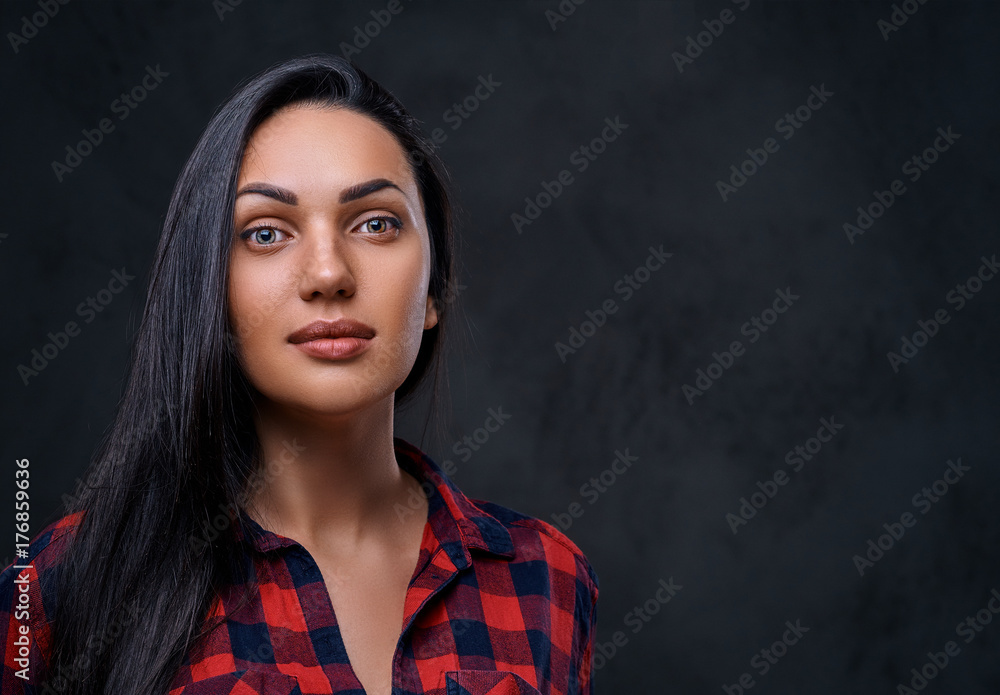 A woman dressed in a red fleece shirt over grey background. A woman dressed in a red fleece shirt over grey background.
