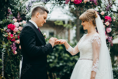 Bride and groom are getting married on the wedding ceremony
