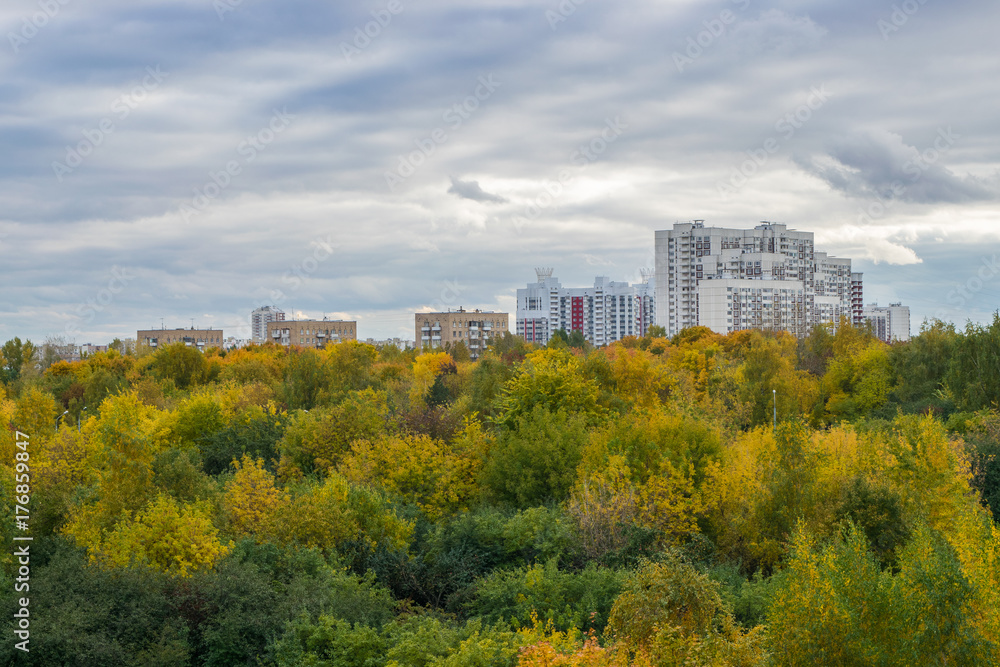View of autumn park and Moscow dormitory area