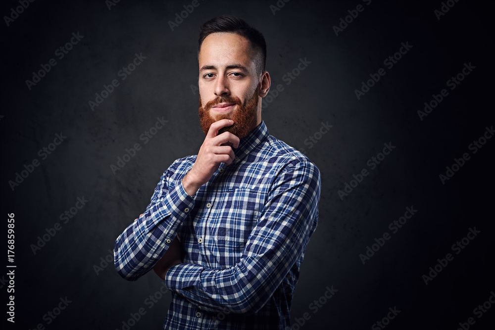 A man with crossed arms, dressed in a blue fleece shirt. A man with crossed arms, dressed in a blue fleece shirt.