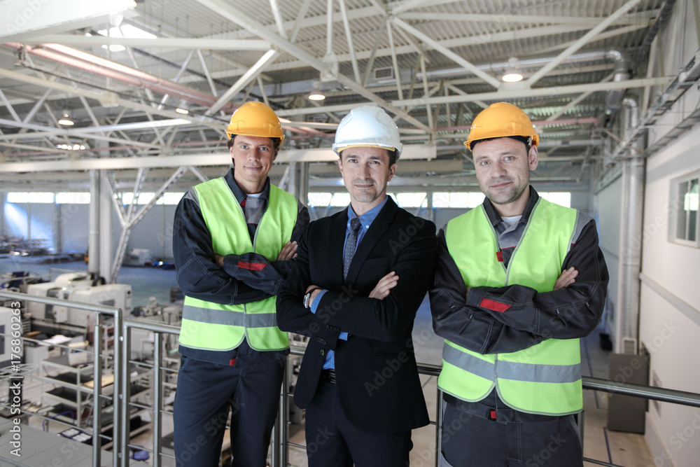 Manager and workers in factory Manager and workers in factory