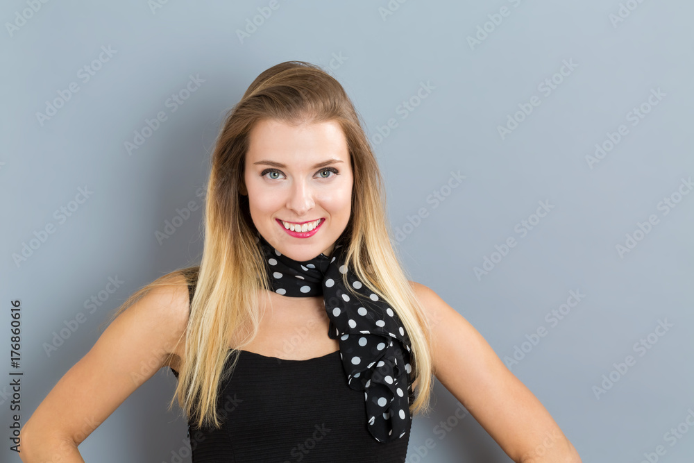 Happy young woman on a gray background Happy young woman on a gray background