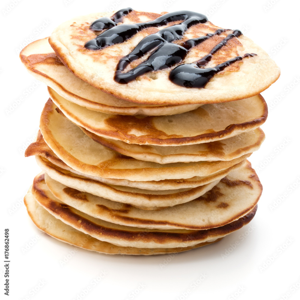 Pancakes stack with chocolate syrup on white background Pancakes stack with chocolate syrup on white background
