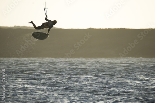 kiters in jumping with surfboard