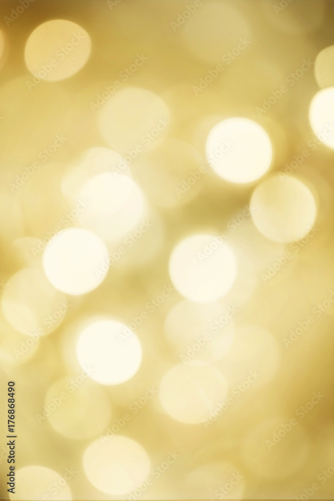 Golden blurred bokeh lights for Christmas and New Year celebration. Magical abstract glittery backgroun with falling snowflakes. Golden blurred bokeh lights for Christmas and New Year celebration. Magical abstract glittery backgroun with falling snowflakes.