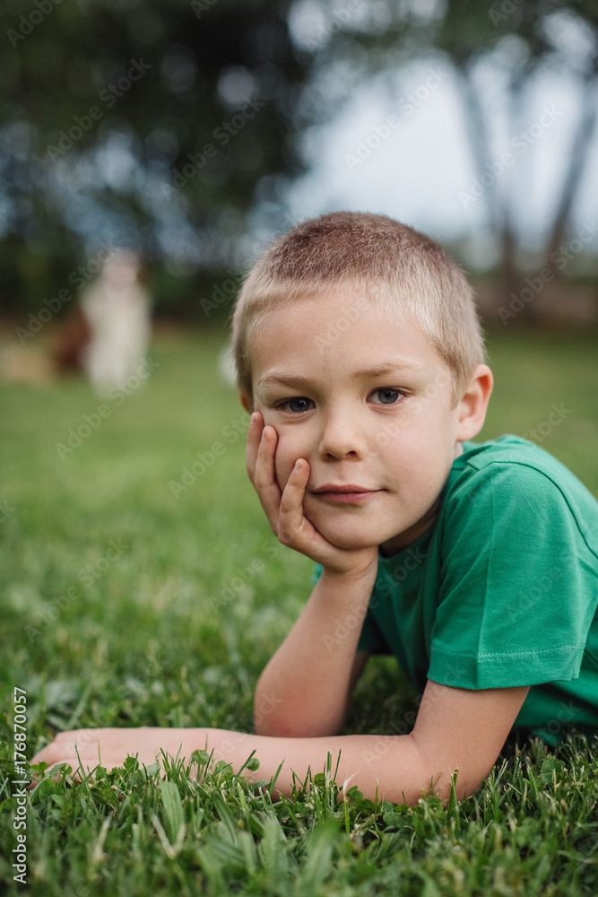 Young boy relaxing in the garden Young boy relaxing in the garden