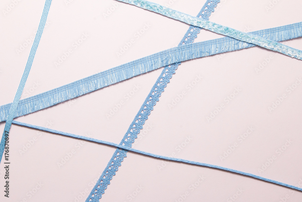 Blue ribbon on paper background
