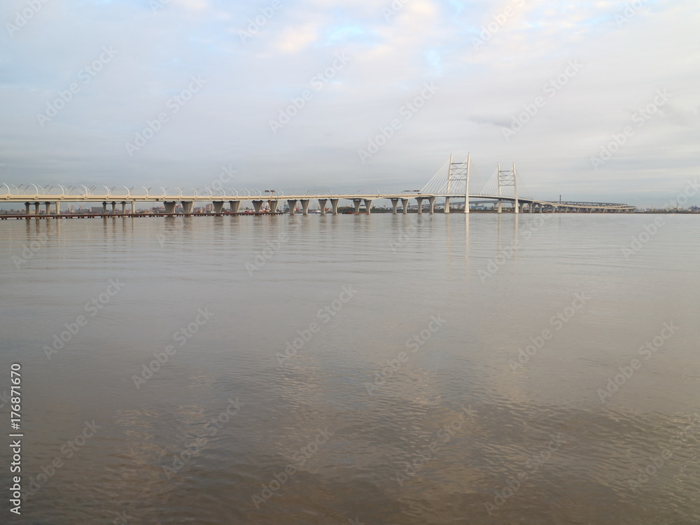 Cable-stayed bridge over the big river in the evening