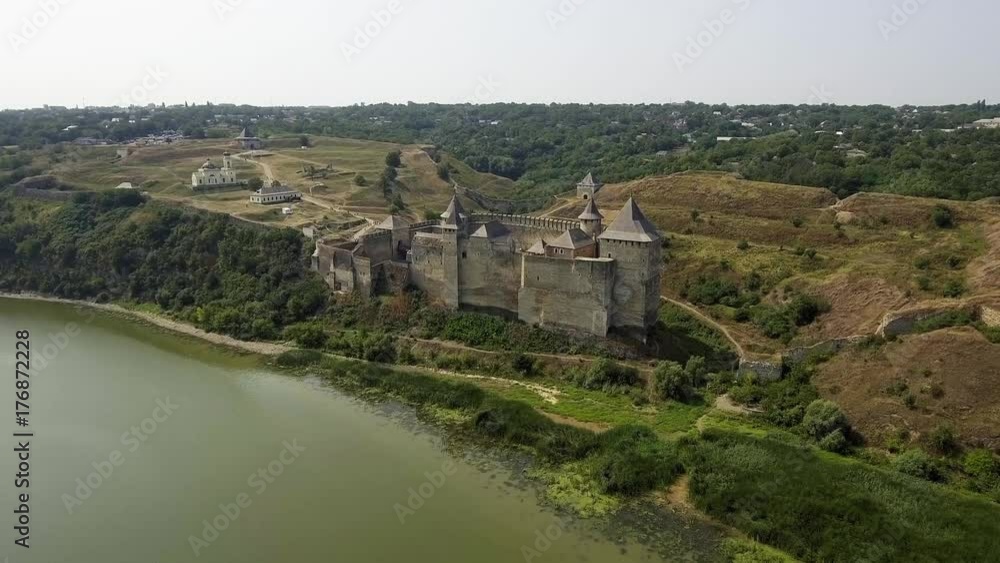 Aerial view of Khotyn medieval castle on the green hill above the river.