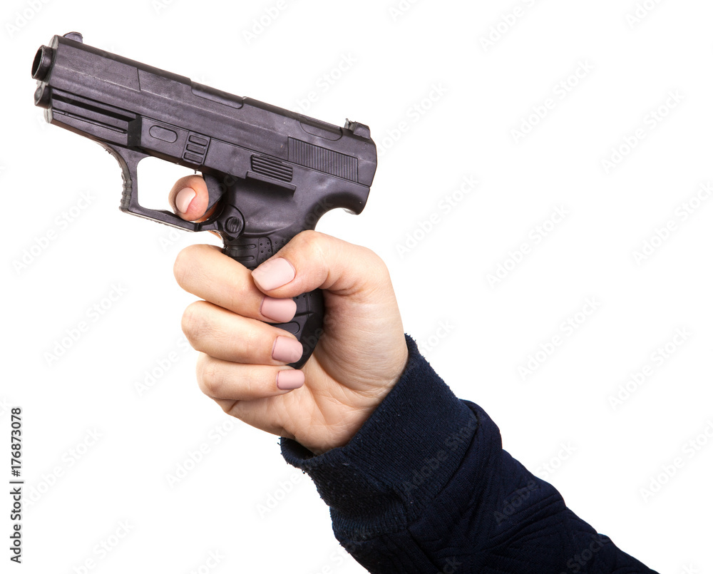 female hand with a toy gun. Isolated on white background female hand with a toy gun. Isolated on white background