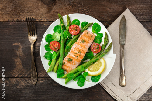 Grilled salmon with asparagus, green salad, and copyspace