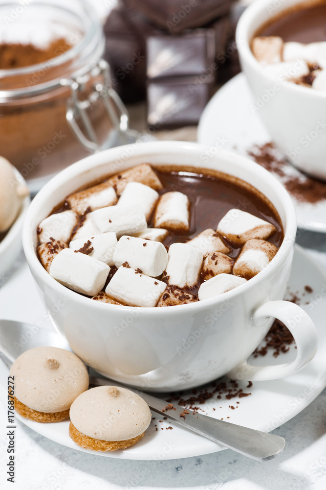 cups of hot chocolate with marshmallows, vertical top view cups of hot chocolate with marshmallows, vertical top view