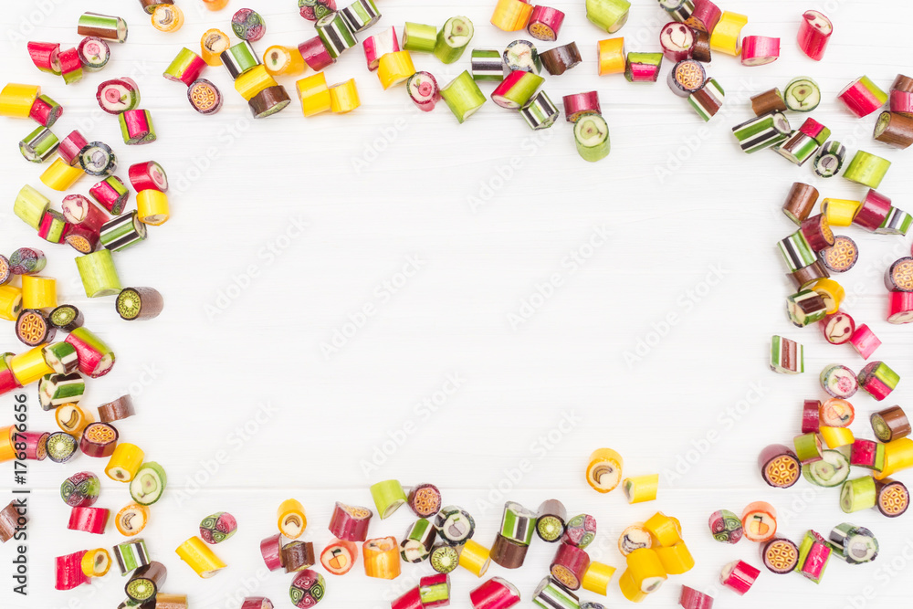 A round frame made of colored caramel candies