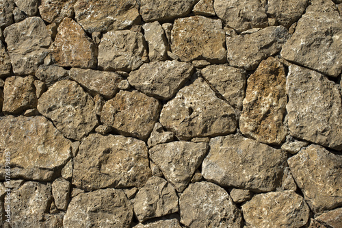 A wall made from densely laid stones