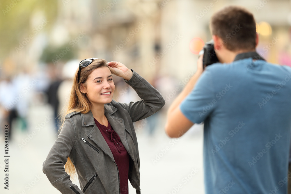 Photographer photographing a model on the street Photographer photographing a model on the street