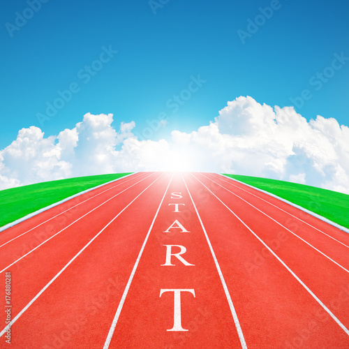 Wording START on running track in blue sky and clouds