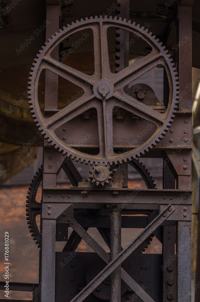 Old metal construction with cogwheel