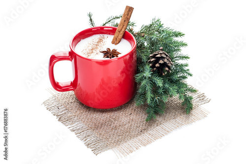 eggnog cocktail in red mug arranged with christmas decoration isolated on white