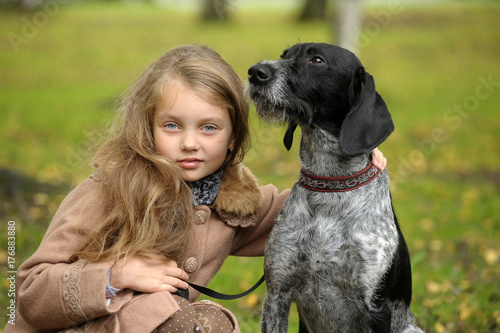 Girl with a dog in the park photo