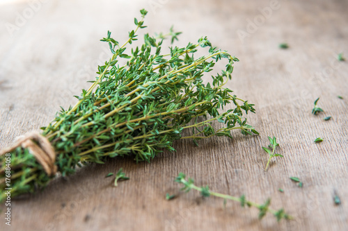Thyme bunch. Bundle of fresh thymes on a wooden background