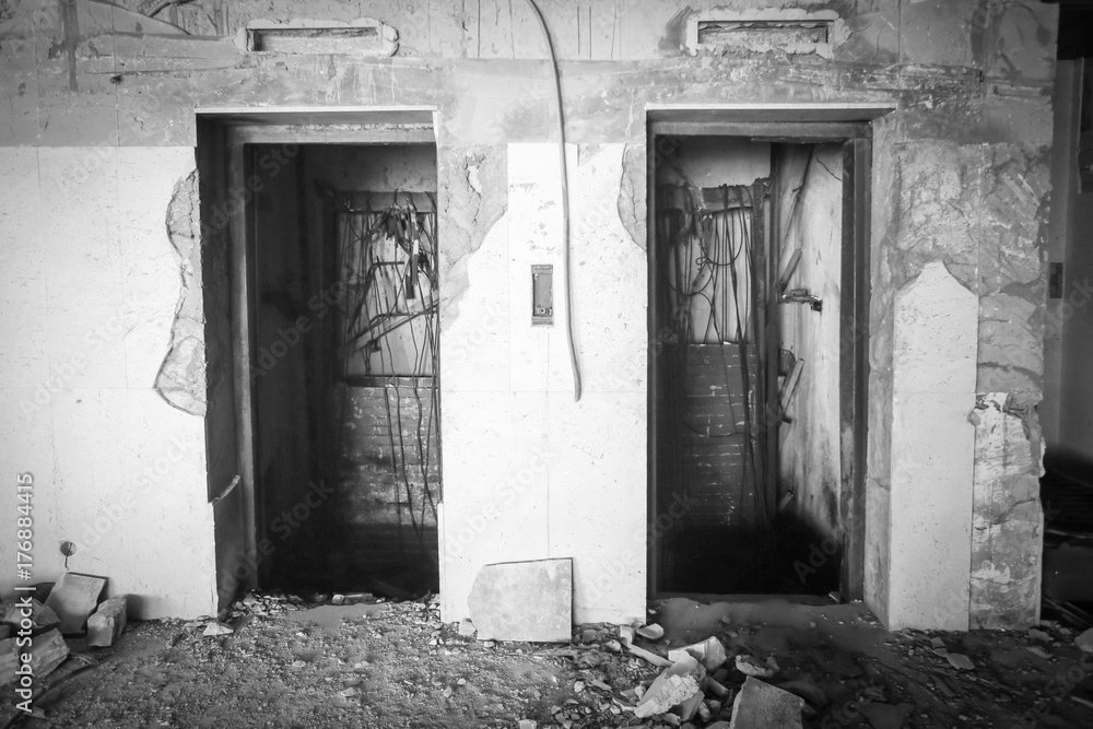 Two doors of elevators in an old ruined hotel. Two doors of elevators in an old ruined hotel.