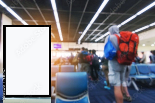 blank advertising billboard or showcase light box with copy space for your text message or media and content with traveler waiting at airport, people, commercial, marketing and advertising concept