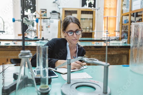 Young Female Scientist Doing Physics Research