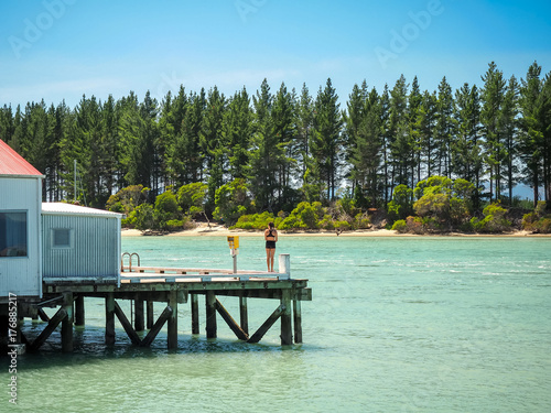 A girl is waiting to jump form the Mapua Wharf. (NZ) 
