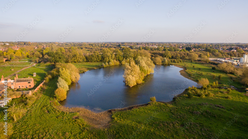 Aerial view over a lake in a park in the countryside