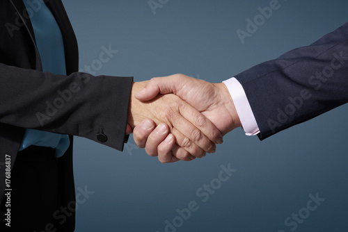 Business people shaking hands at isolated background