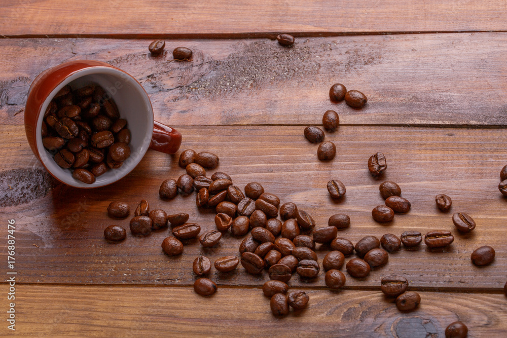 scattering of beans and a cup scattering of beans and a cup